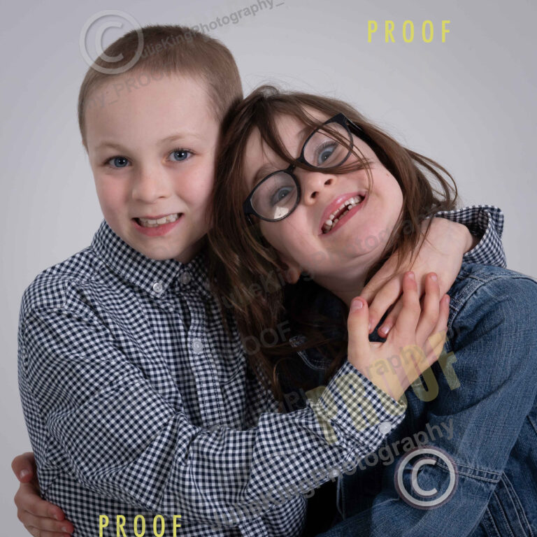 Professional family portrait in a Bromsgrove studio with soft lighting and a relaxed atmosphere.