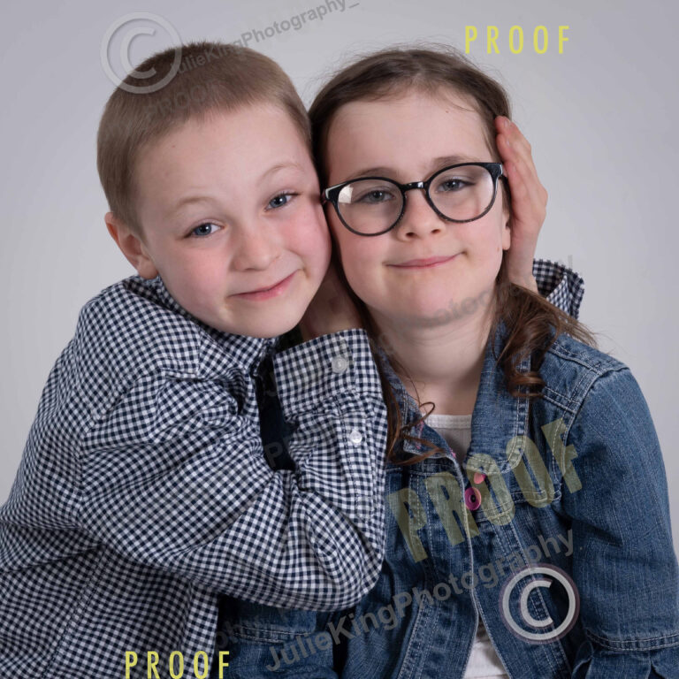 Elegant black-and-white family portrait in a Bromsgrove photography studio.