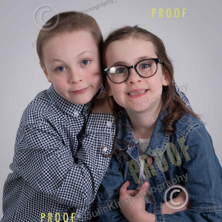 Elegant black-and-white family portrait in a Bromsgrove photography studio.