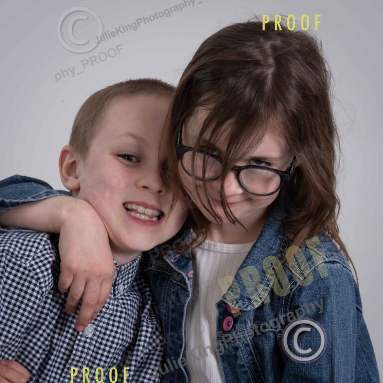 Elegant black-and-white family portrait in a Bromsgrove photography studio.